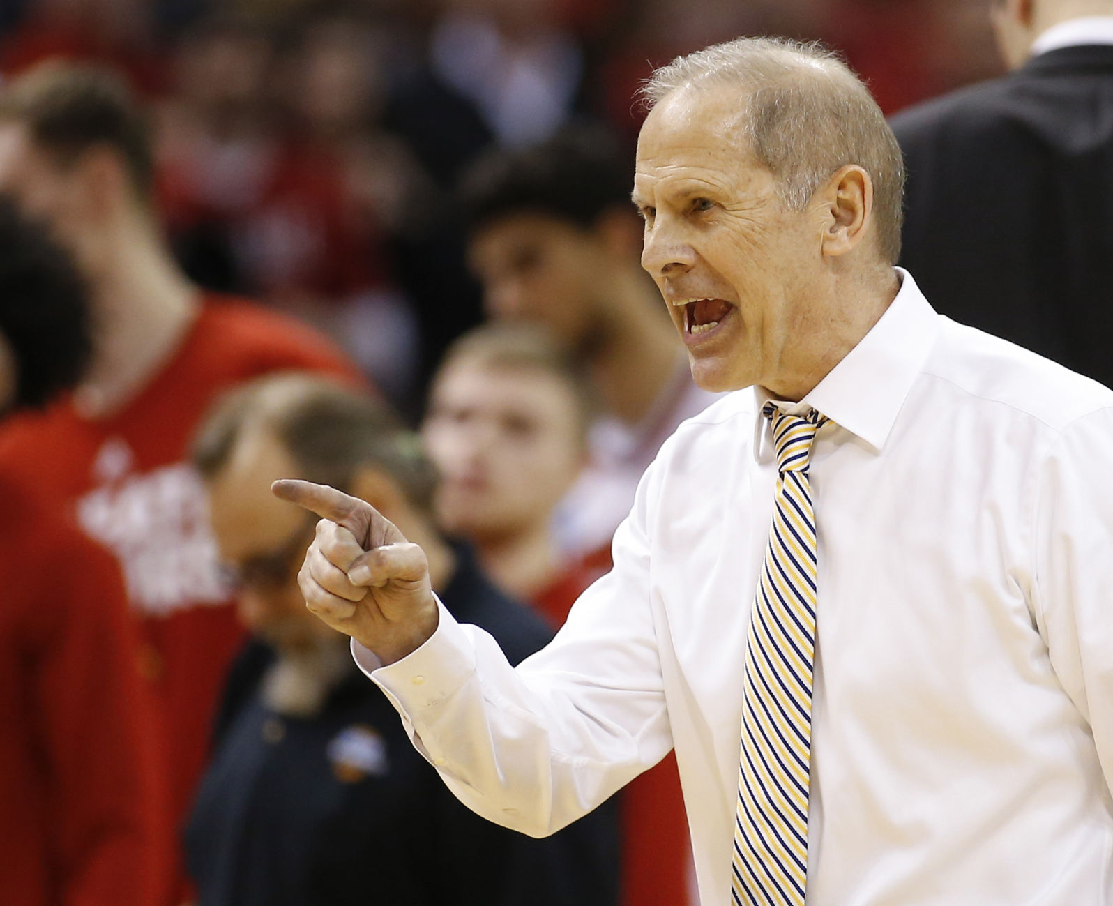 Michigan Wolverines head coach John Beilein reacts to a win over Louisville in the second round of the NCAA men's college basketball tournament on Sunday, March 19, 2017, in Indianapolis, Ind. Beilein is leaving Michigan to coach the Cavaliers in the NBA.